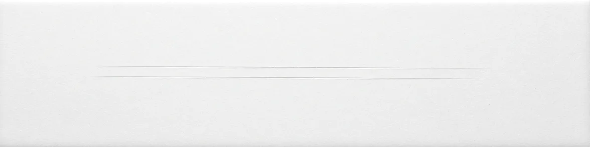 A bare white porcelain streak plate with two fine scratches cut across it and no powder on it.